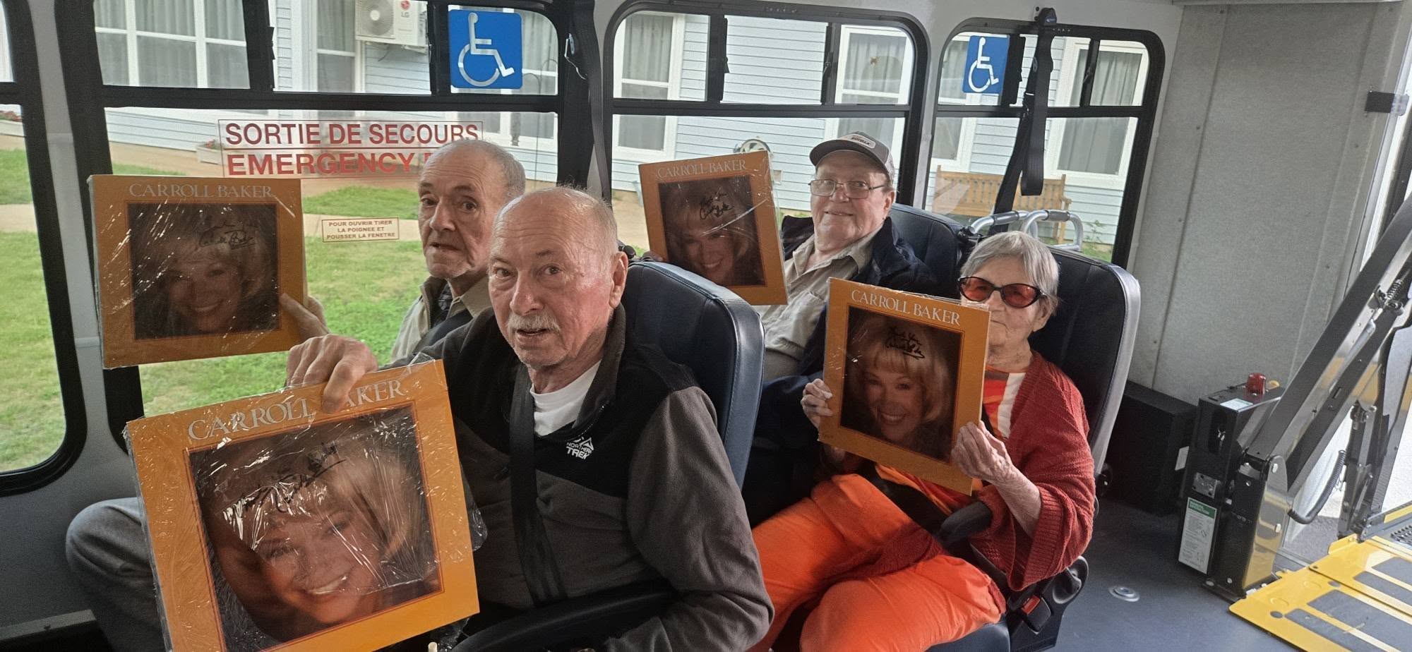 Residents in facility shuttle bus